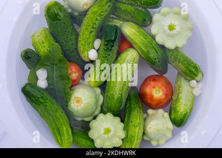 Making salad from fresh garden vegetables. Stock Photo