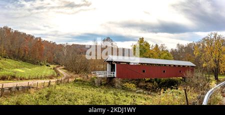 Marietta, Ohio, USA-Oct. 25, 2022: Beautiful autumn panoramic landscape of the restored Rinard Covered Bridge, originally built in 1876 but was destro Stock Photo