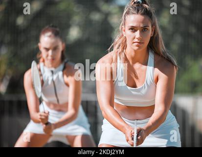 Badminton practice, double games and training women ready to start professional competition match in Melbourne, Australia. Tennis court player Stock Photo