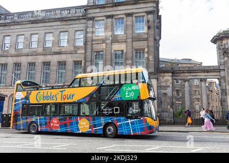 Cobbles Tour double decker sightseeing bus on Princes Street in Edinburgh city centre, Scotland,UK, summer 2022 Stock Photo