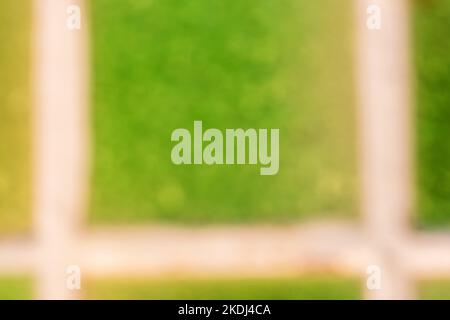Close up blur of green mosaic on wall in bathroom. Abstract stylish blurred tile texture. Light Green template for design. Defocused art abstract back Stock Photo