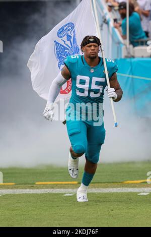 Saturday, November 6, 2022; Jacksonville, FL USA;  Jacksonville Jaguars defensive end Roy Robertson-Harris (95) runs from the tunnel at the start of a Stock Photo