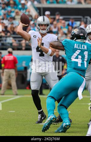 Saturday, November 6, 2022; Jacksonville, FL USA;  Las Vegas Raiders quarterback Derek Carr (4) drops back to pass during an NFL game against the Jack Stock Photo