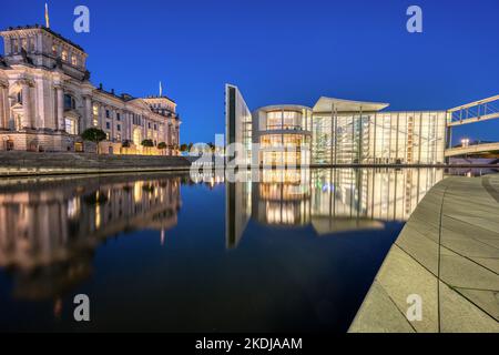 Part of the Reichstag and the Paul-Loebe-Haus at the river Spree in Berlin at night Stock Photo