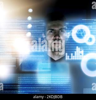 Building the perfect program. a focussed young computer programmer working on his coding late at night. Stock Photo