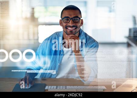 Its all coming together now. Portrait of a happy computer programmer working on new software at his computer. Stock Photo