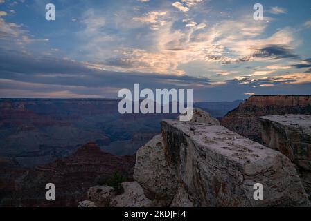 Scenic View Of Rock Formations And Mountains under cloudy sky Stock Photo
