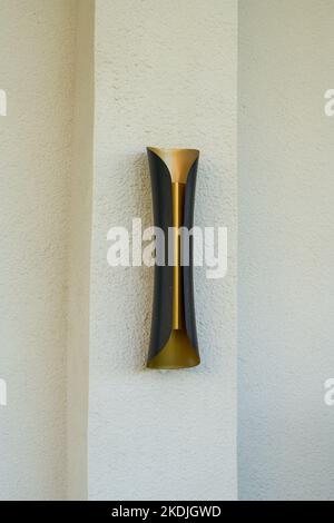 Closeup of hanging wall lamp in modern strip metal style Stock Photo