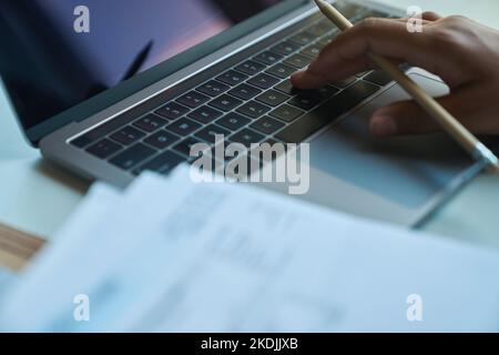 Process of typing on a laptop keyboard at the workplace Stock Photo