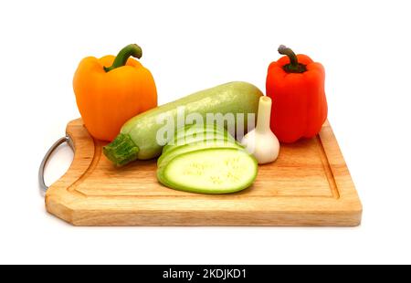 Zucchini, head of garlic and a pair of ripe yellow and orange sw. Stock Photo