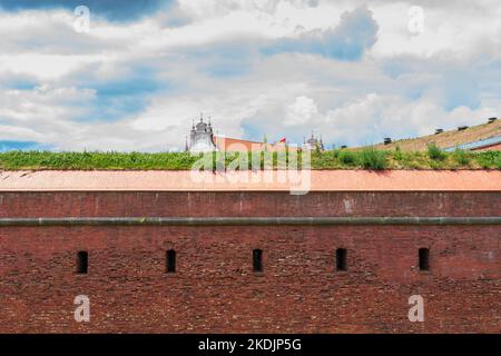 Defensive walls of the city of Zamość. Church in the background. Zamosc, Poland Stock Photo