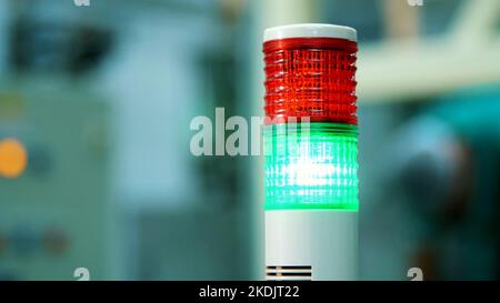 production, workshop, close-up of a special lamp of red and green color. there is a manufacturing process, a work process. High quality photo Stock Photo