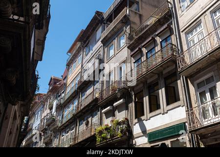 Domestic houses facades with tiled bricks on typical old buildings in Porto Stock Photo