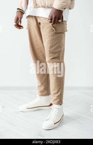 Catalogue fashion studio shoot Men legs in cargo trousers Stock Photo