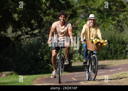 business man woman pushing bike city concept Stock Photo