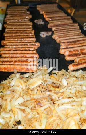 BBQ, barbecue with onion and sausages Stock Photo