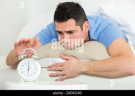 young man does not want to wake up Stock Photo