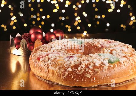 delicious spanish sweet roscon de reyes (Epiphany cake) with christmas decorations Stock Photo