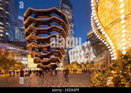 Hudson Yards esplanade with The Vessel and the Shed in evening with Christmas decorations. Winter in Midtown West, Manhattan, New York City Stock Photo