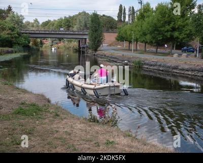 Lokeren, Belgium, August 27, 2022, friends and family sail with a pleasure boat on the river Durme in Lokeren Stock Photo