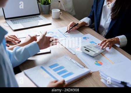 business people use documents and computers to analyze marketing Stock ...