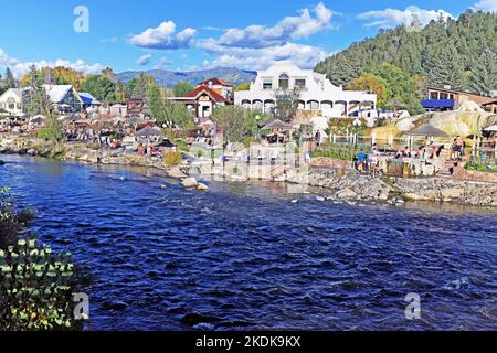 The San Juan River flows by The Springs Resort and Spa in Pagosa Springs, Colorado on October 6, 2022. Stock Photo