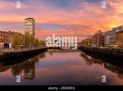 Pink sky reflections in Dublin City on a mild November evening Stock Photo