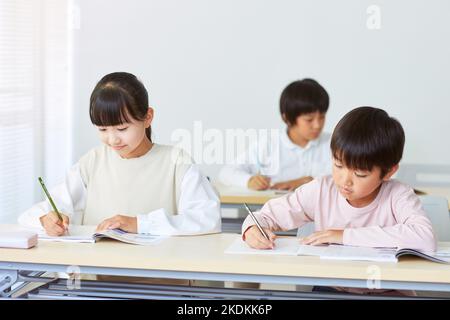 Japanese kids studying Stock Photo