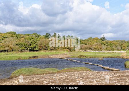 Old stepping stones to cross Ewenny River at Ogmore Castle. Ogmore by Sea, Glamorgan, Wales, United Kingdom - 15th of October 2022 Stock Photo