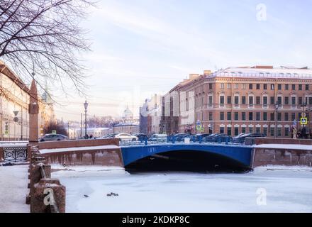 Winter Petersburg. Blue bridge and ancient buildings on the embankments of the Moika River Stock Photo