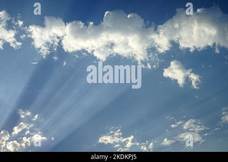 Sun beams on the clouds - Crepuscular rays Stock Photo