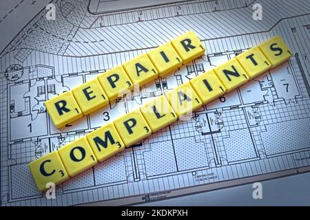 Repair Complaints - Scrabble letters on plans for a housing scheme - Property Issues Stock Photo