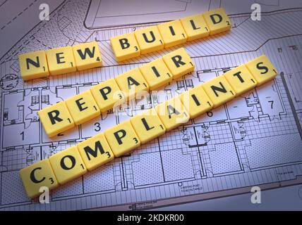 New build repair complaints - Scrabble letters on plans for a housing scheme - Property Issues Stock Photo
