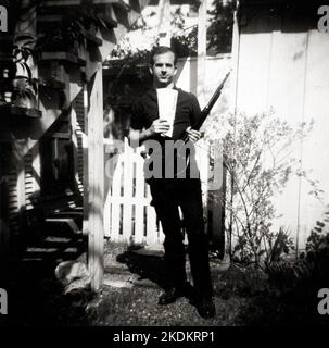 Lee Harvey Oswald with rifle, taken in Oswald's back yard, Neely Street, Dallas Texas, March 1963. The photo was Warren Commission exhibit 133-A. Stock Photo