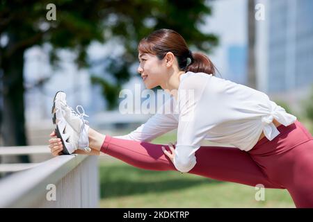 Young Japanese training downtown Stock Photo