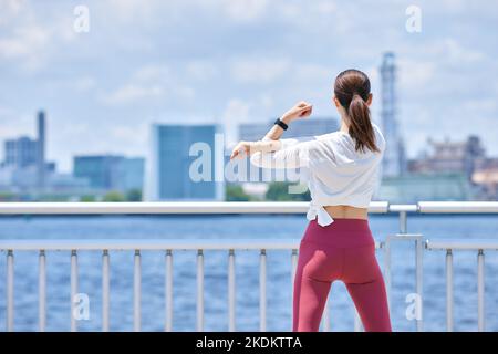 Young Japanese training downtown Stock Photo