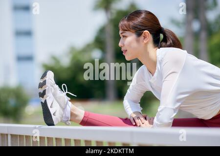 Young Japanese training downtown Stock Photo