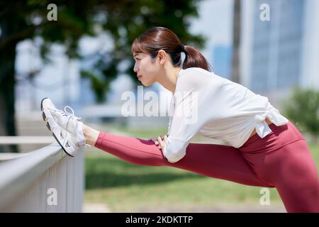 Young Japanese training downtown Stock Photo