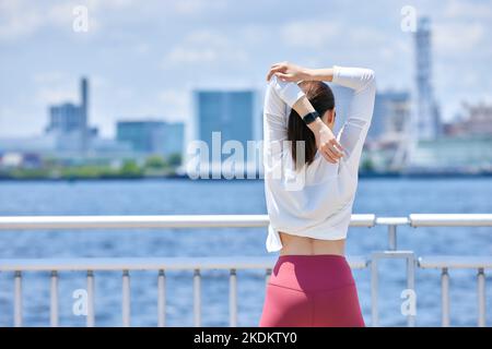Young Japanese training downtown Stock Photo