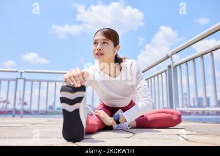 Young Japanese training downtown Stock Photo