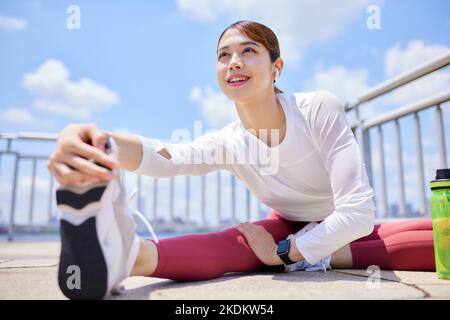 Young Japanese training downtown Stock Photo