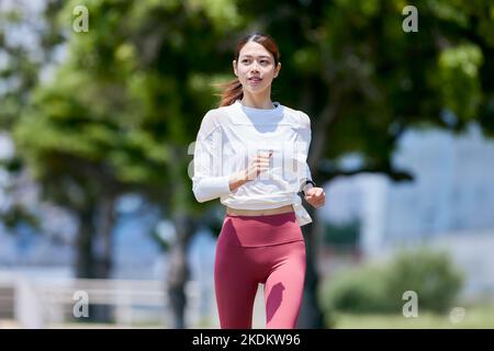 Young Japanese training downtown Stock Photo