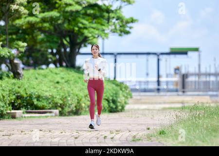 Young Japanese training downtown Stock Photo