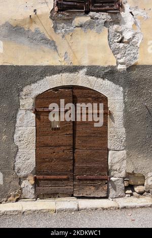 Old Wooden Door or Doorway or Dilapidated Building in Beauvezer Alpes-de-Haute-Provence Provence France Stock Photo