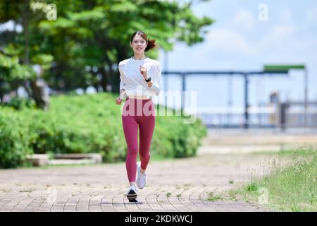 Young Japanese training downtown Stock Photo