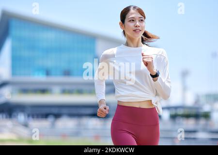 Young Japanese training downtown Stock Photo