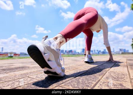 Young Japanese training downtown Stock Photo