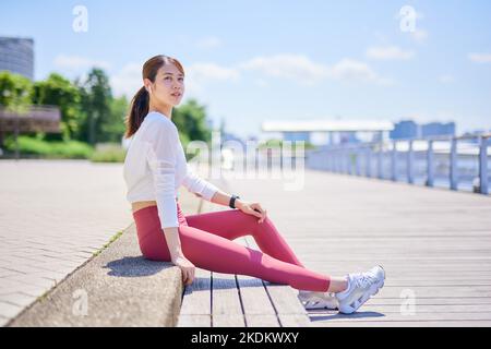 Young Japanese training downtown Stock Photo