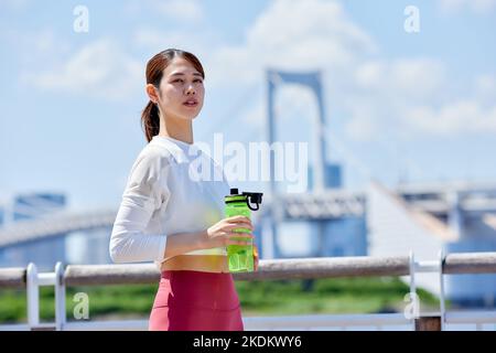 Young Japanese training downtown Stock Photo