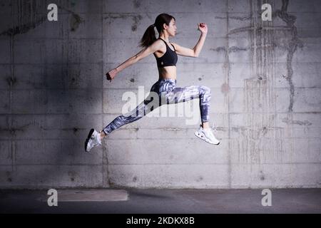 Young Japanese training downtown Stock Photo